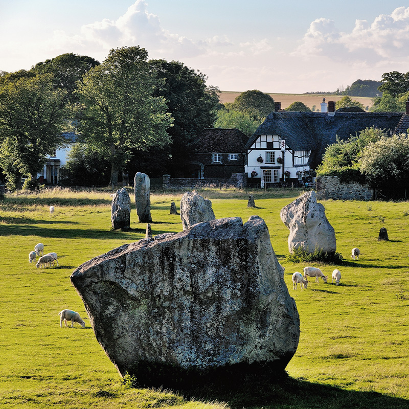 Avebury Neolithic henge and stone circles, Wiltshire, England. 5600 years old. Over inner South Circle toward village pub